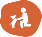 A person kneeling down with their dog